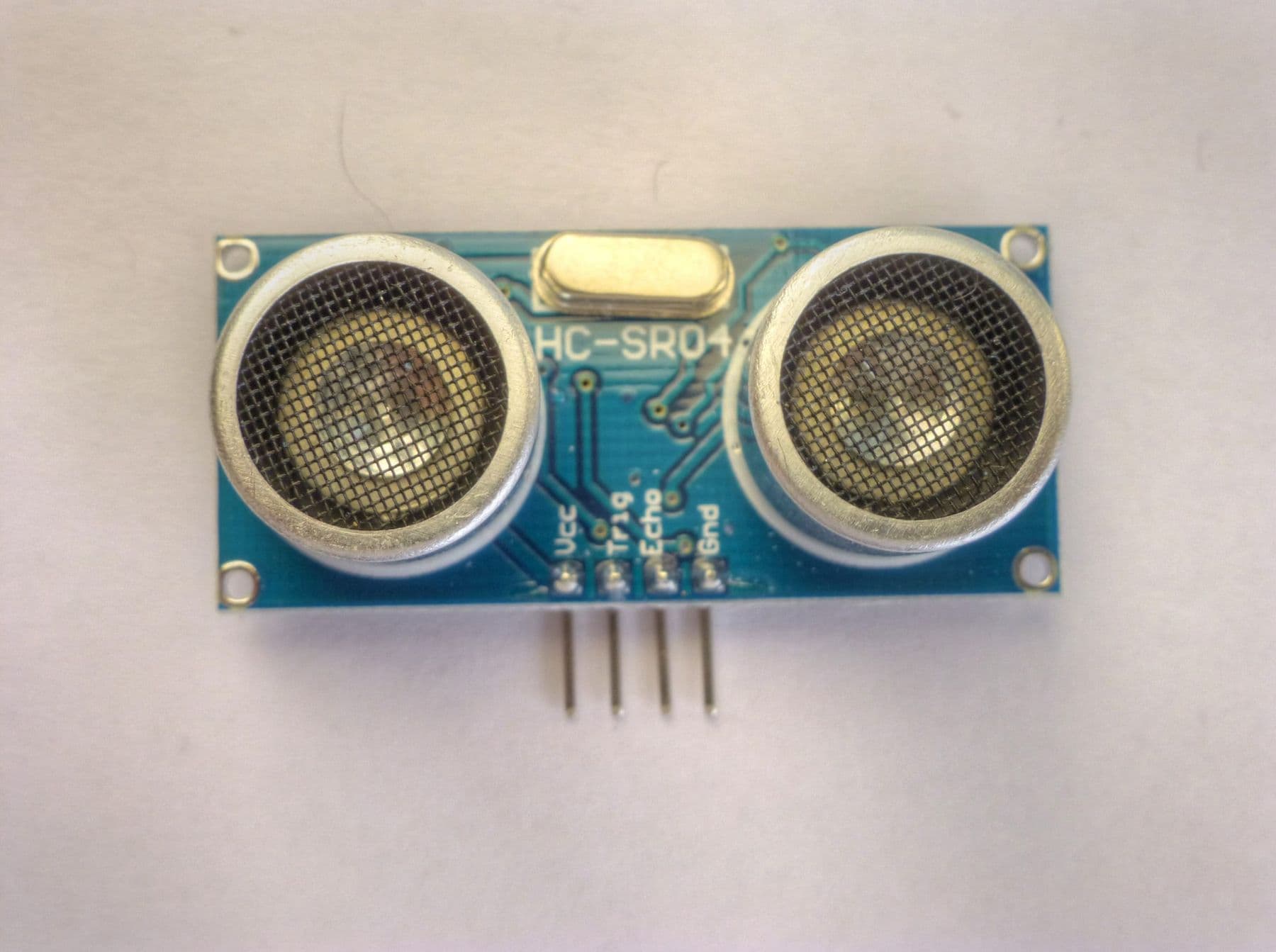 HC-SR04 ultrasonic distance sensor with its two cylindrical transducers
