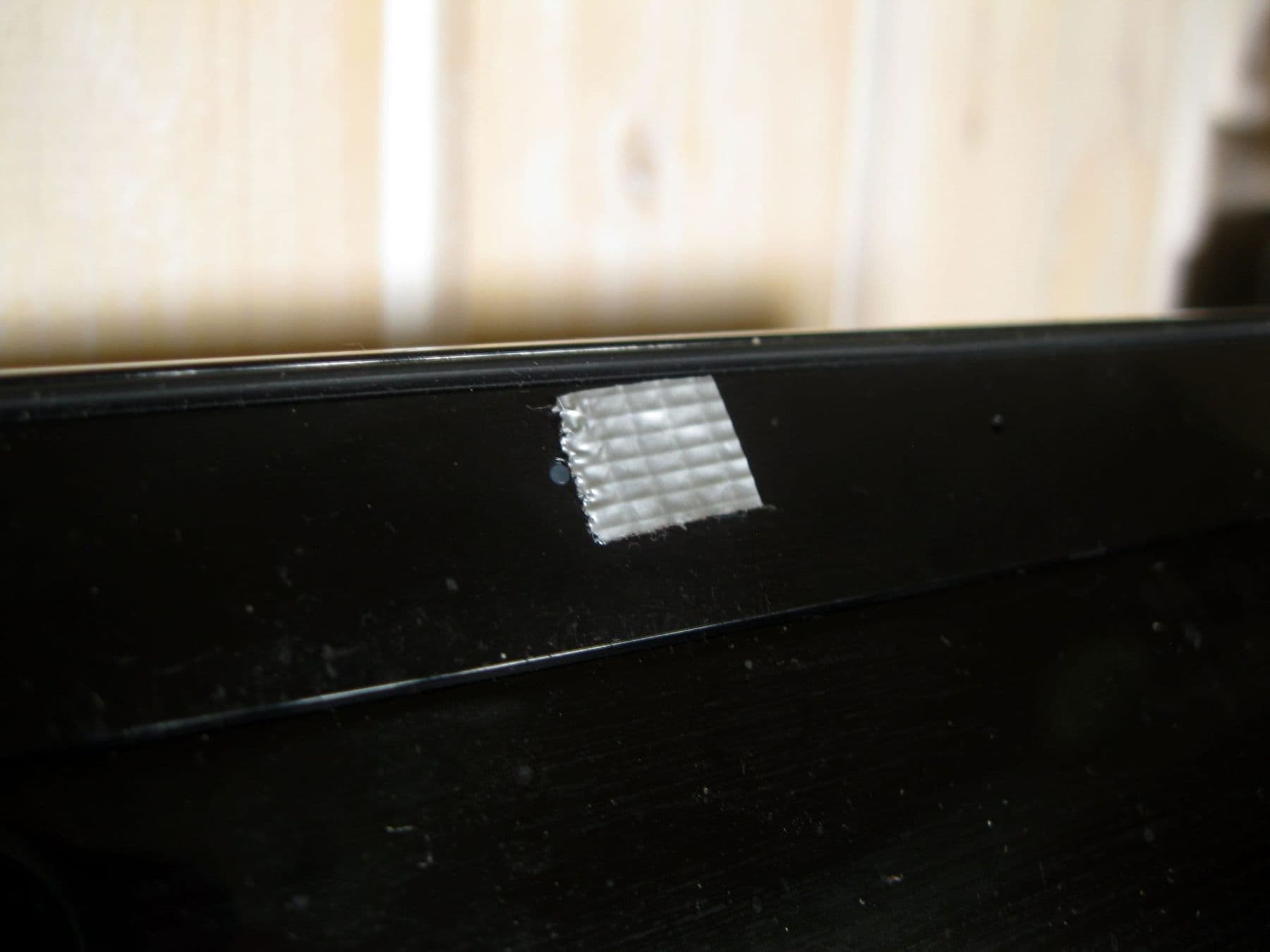 A laptop webcam covered with tape, a simple privacy habit for families