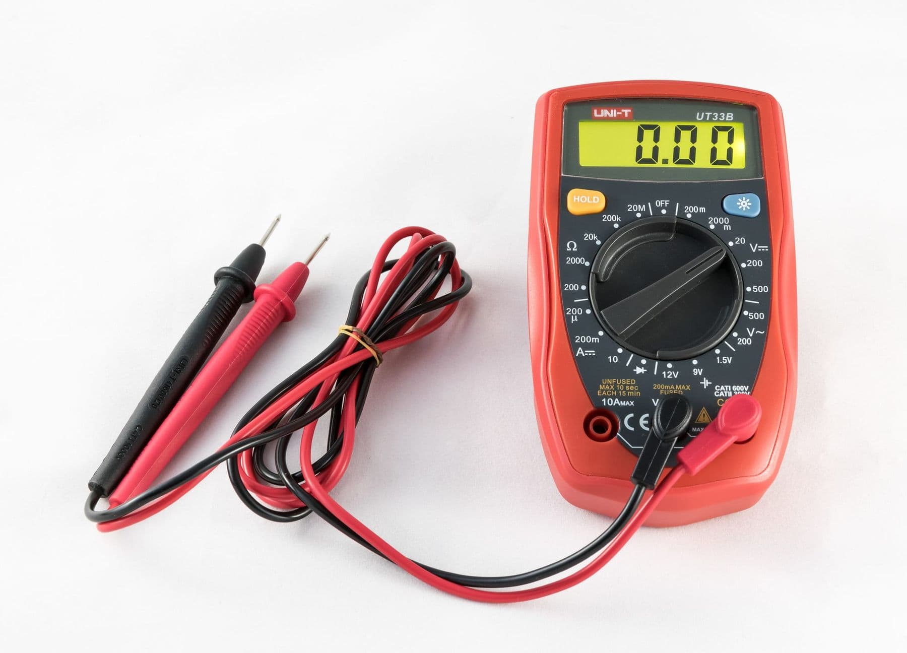 Digital multimeter with red and black probes for measuring voltage, current and resistance
