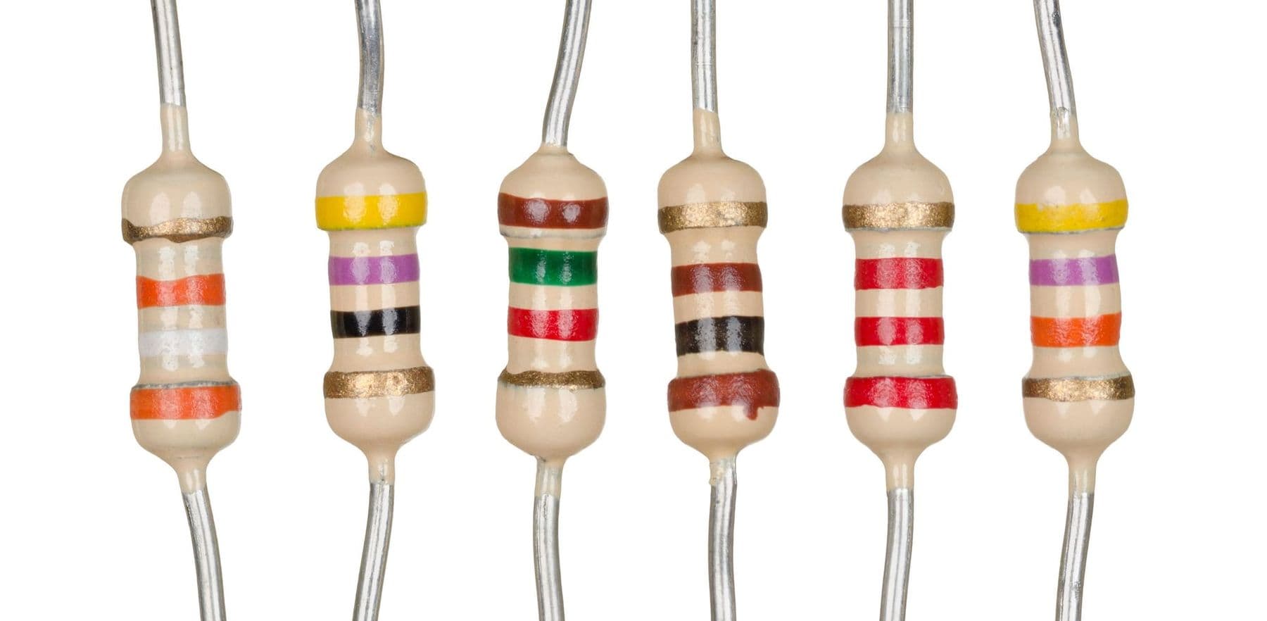 Six through-hole resistors with colour bands, the basics of Ohm's law