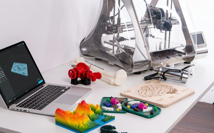 Laptop with a 3D model and printed figures